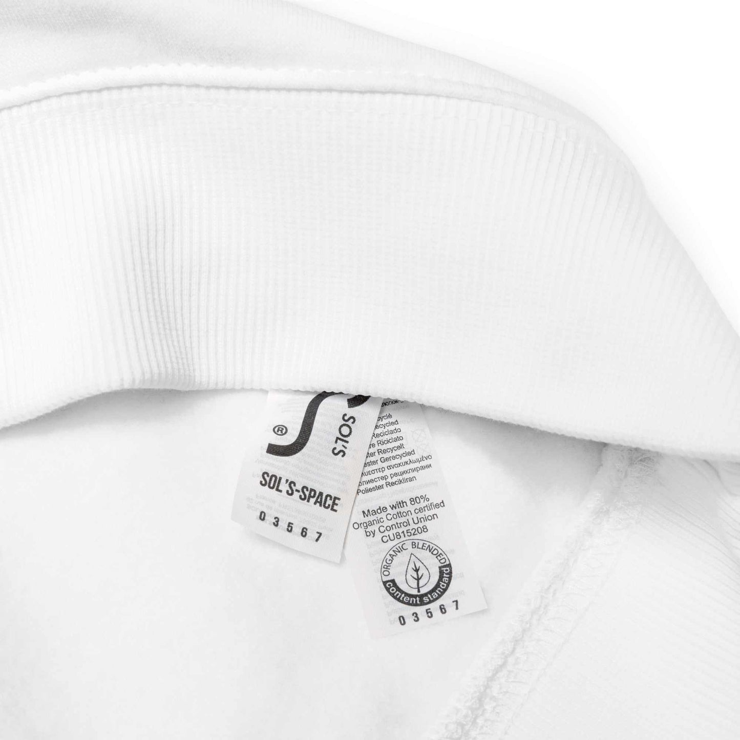 Close-up of white Floral Face Sweater collar showing organic cotton and sustainability care labels