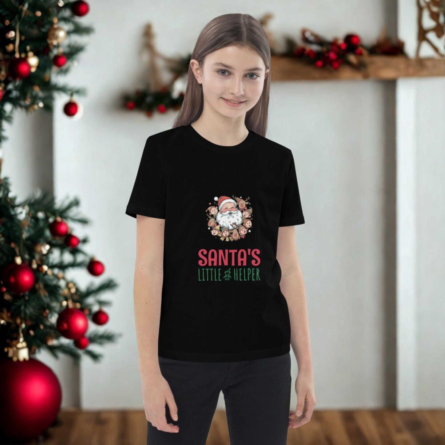 Girl wearing black Santa's Little Helper Christmas T-Shirt with Santa graphic and festive background