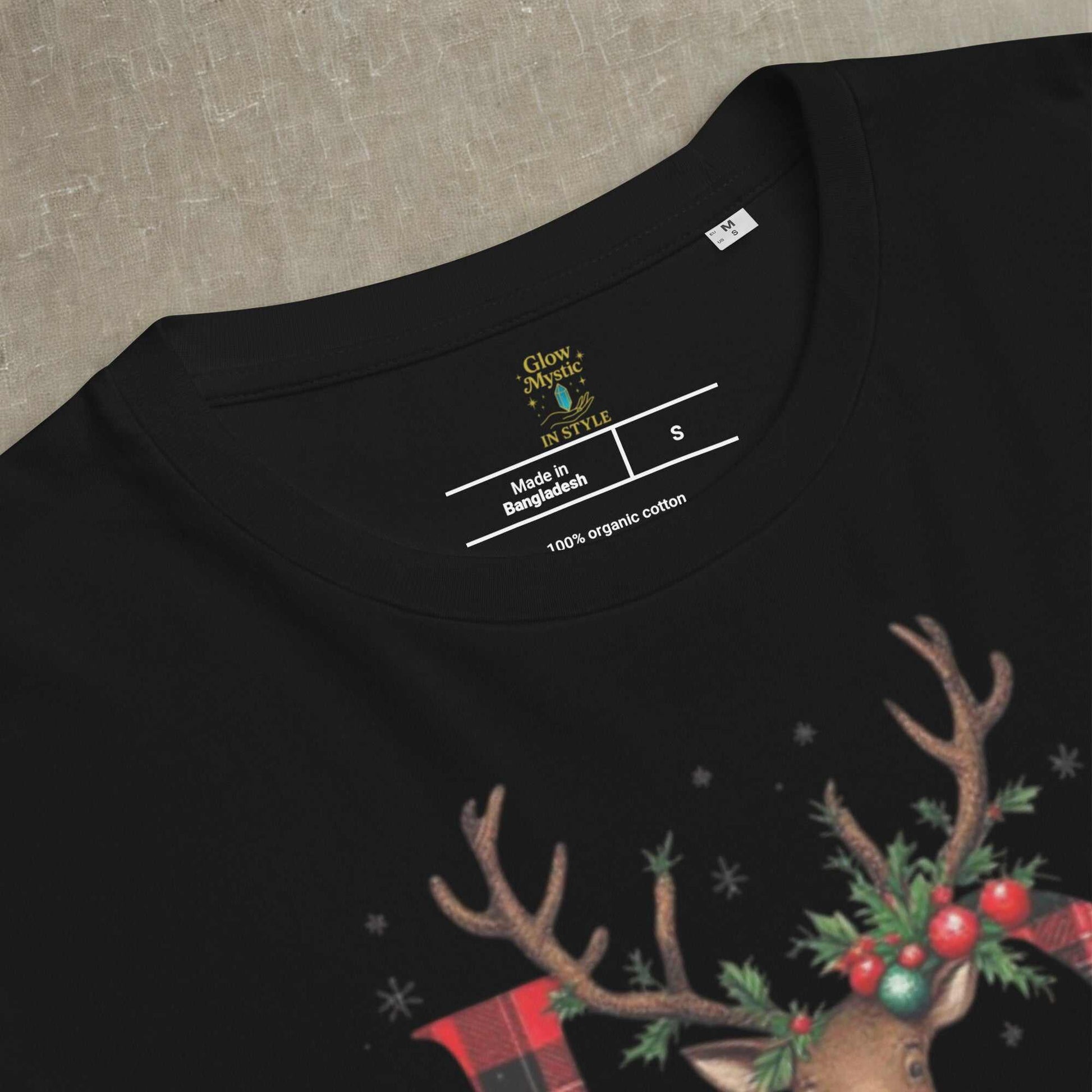 Black organic cotton Christmas t-shirt with festive reindeer and holiday greenery print