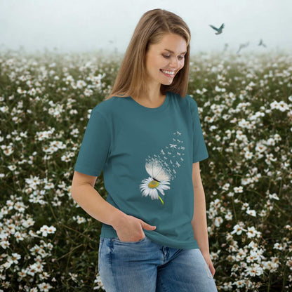 Woman wearing Bloom & Fly Mystic Daisy Organic Cotton Tee with daisy graphic in a flower field