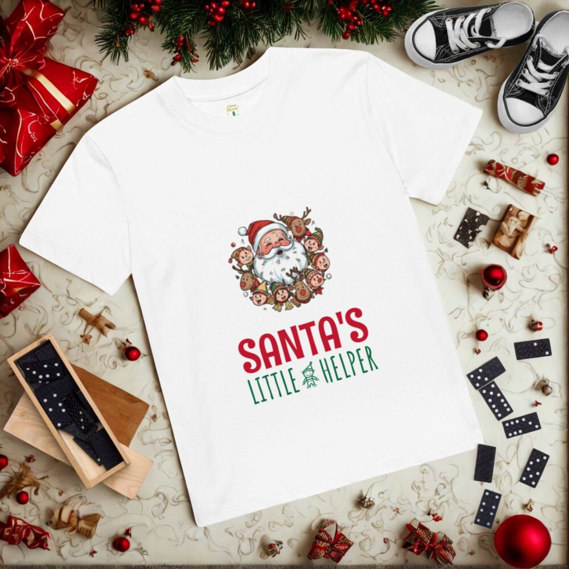 White Santa's Little Helper Christmas T-Shirt with festive Santa and reindeer design surrounded by holiday decorations and gifts
