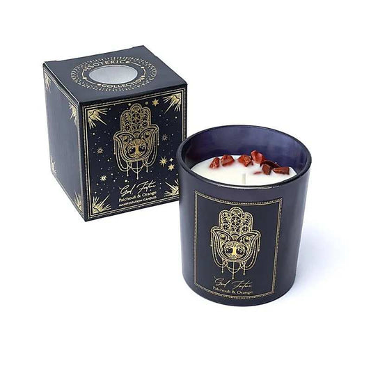 Manifestatiekaars Good Fortune met patchouli, sinaasappel en rode jaspis in stijlvol zwart glas met gouden details.