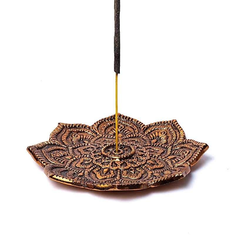 Wellness Box incense holder with lotus design and burning incense stick