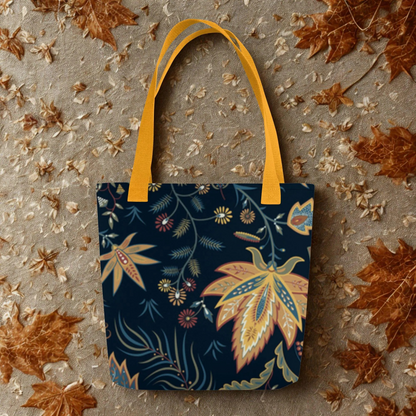 Autumn Floral Tote Bag with warm leaf design and yellow handles on fall leaf background