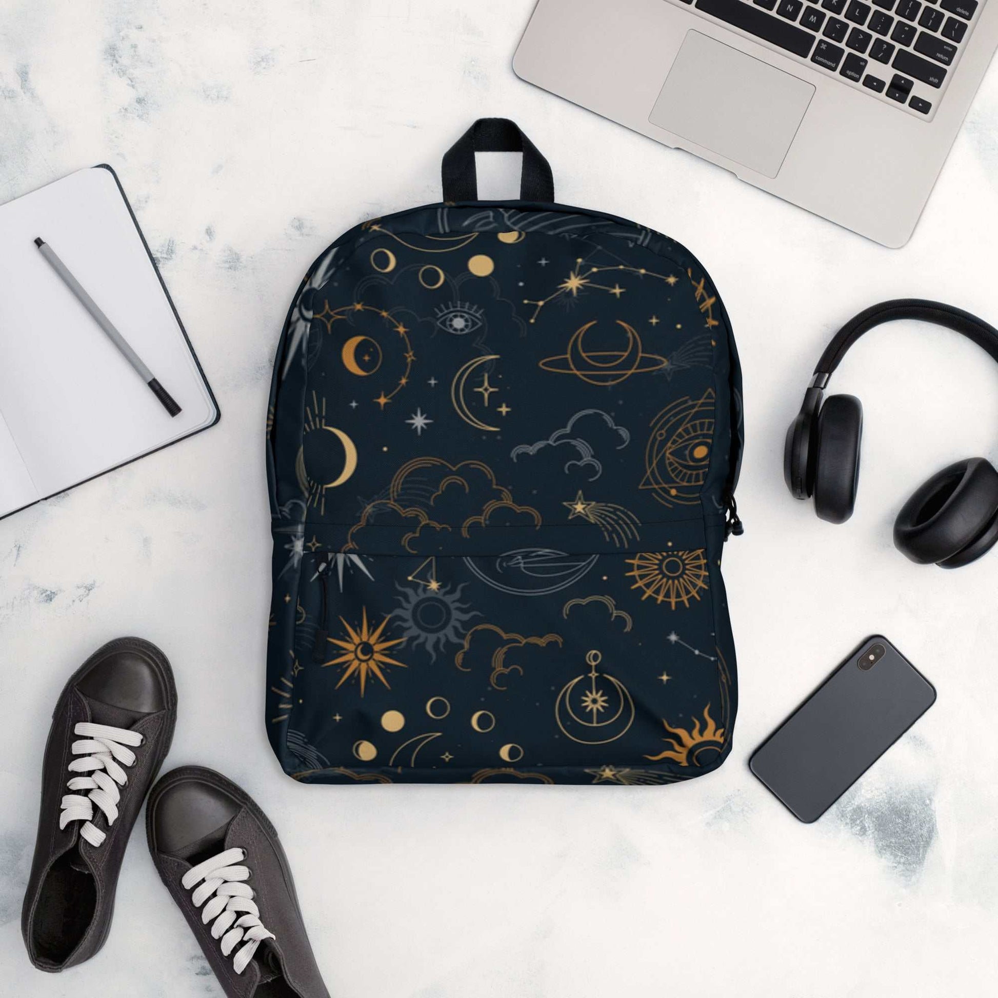 Mystic Moons and Stars Backpack with celestial design, durable polyester, multiple compartments, padded straps, and water-resistant fabric.