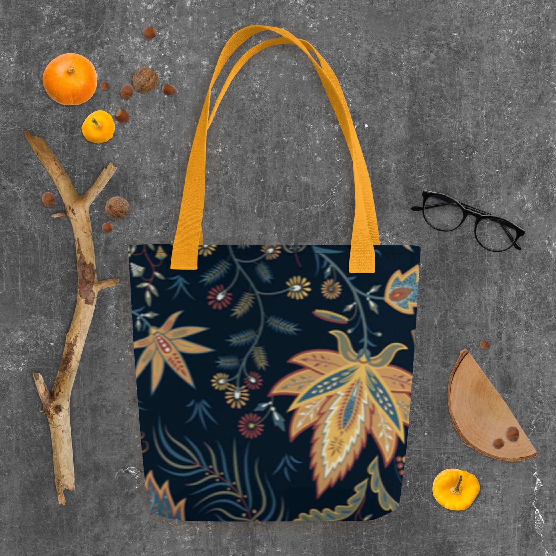 Autumn Floral Tote Bag with colorful fall leaves and floral pattern on dark background with yellow handles