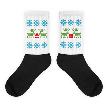 Black and white socks with Christmas reindeer and blue snowflake pattern, ribbed crew length, unisex holiday design