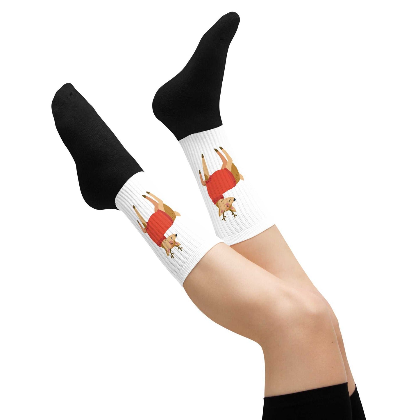 White crew socks with ribbed texture featuring a festive Christmas reindeer illustration and black toes and heels