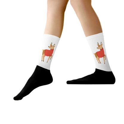 White crew socks with printed Christmas reindeer illustration and black foot section, ribbed cotton blend fabric
