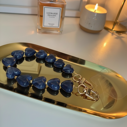 Glow Mystic in Style Blauw hartjes koord op goudkleurige schaal