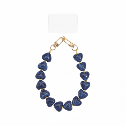 Glow Mystic in Style blauwe hartjes telefoonketting vastgemaakt aan smartphone hoesje