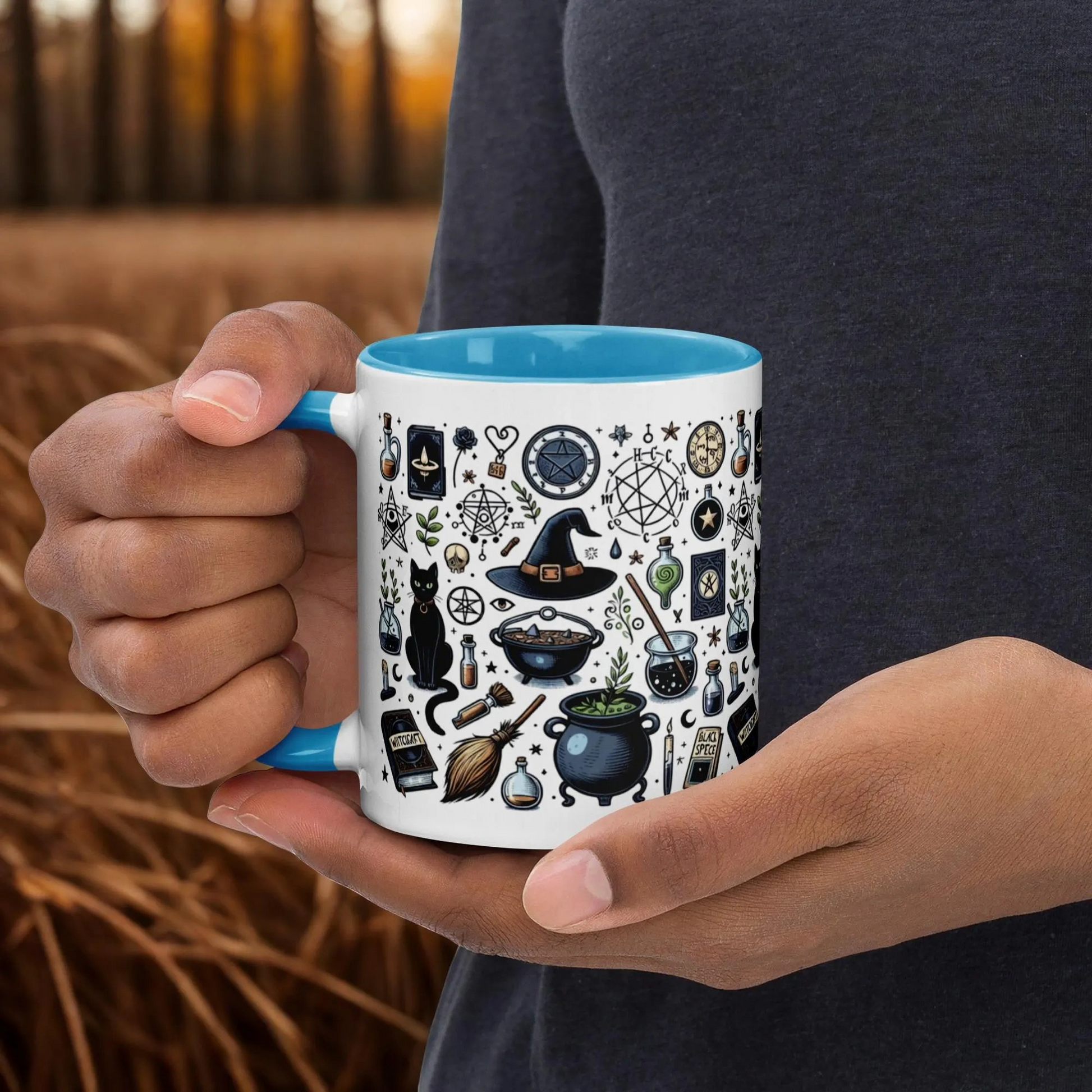 Cats and Cauldrons Halloween Coffee Mug with witch hat, black cat, cauldron, and spooky Halloween designs, ceramic with blue rim and handle.