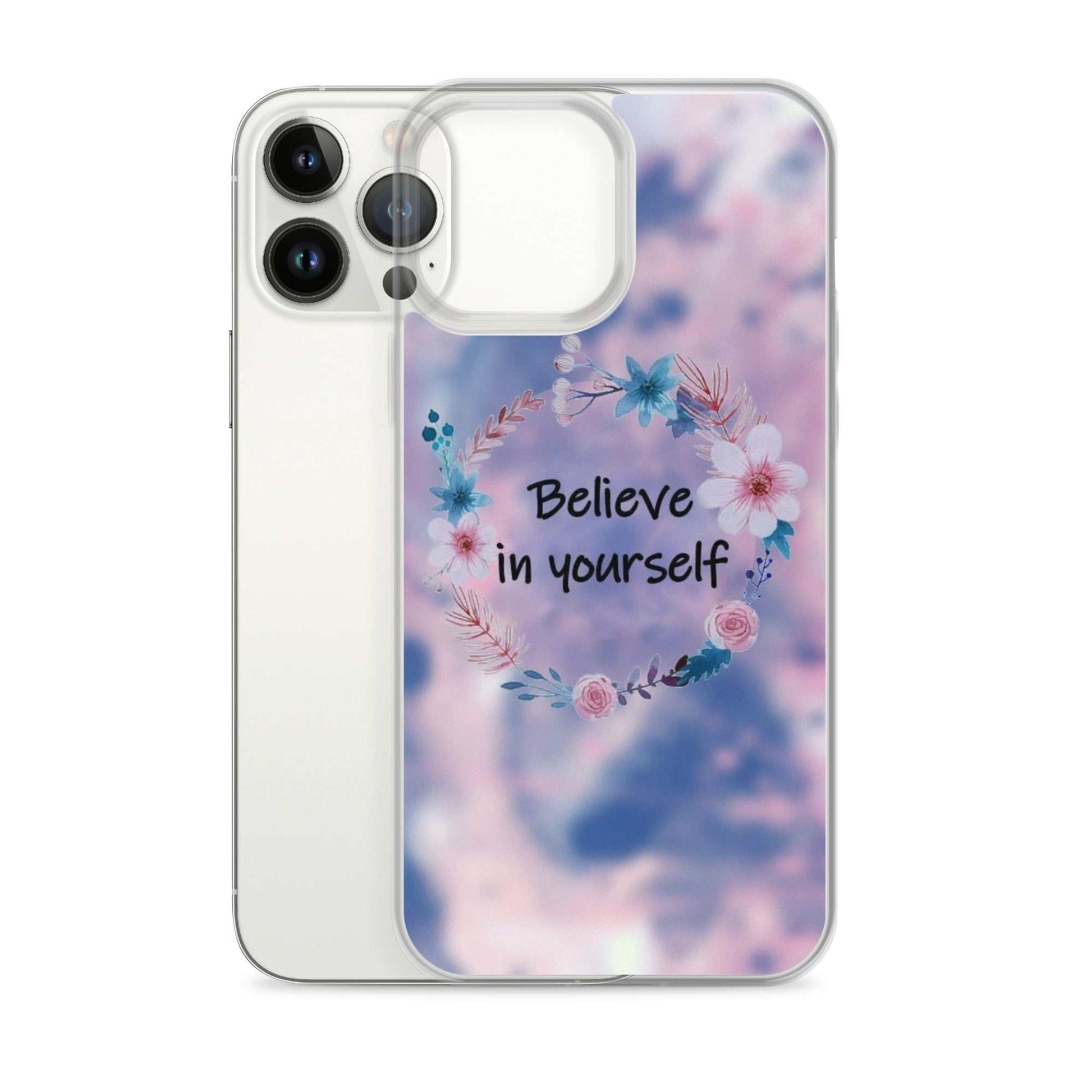 Phone case with floral design and 'Believe in yourself' text on a blurred background
