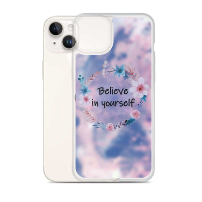 Phone case with floral design and 'Believe in yourself' text on a blurred background