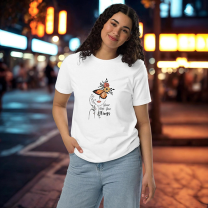 Woman wearing Butterfly Graphic Organic Cotton T Shirt with butterfly and floral design on white fabric in urban night setting