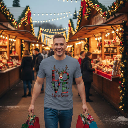 Man wearing organic cotton Christmas t-shirt with festive "LOVE Christmas" reindeer print in a cozy indoor setting