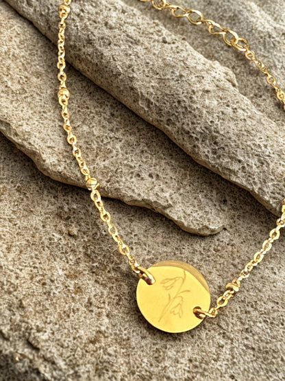 goudkleurige geboortebloem armband met persoonlijke gravure