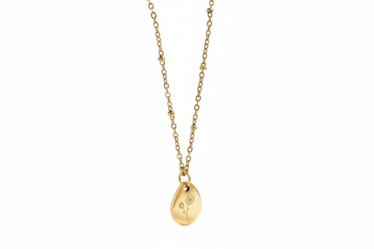 Gouden geboortebloem ketting met gegraveerde bloem bedel