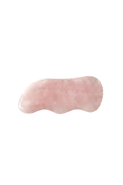 Handgeslepen rozenkwarts gua sha steen voor gezichtsmassage en onvoorwaardelijke zelfliefde - Glow Mystic in Style.