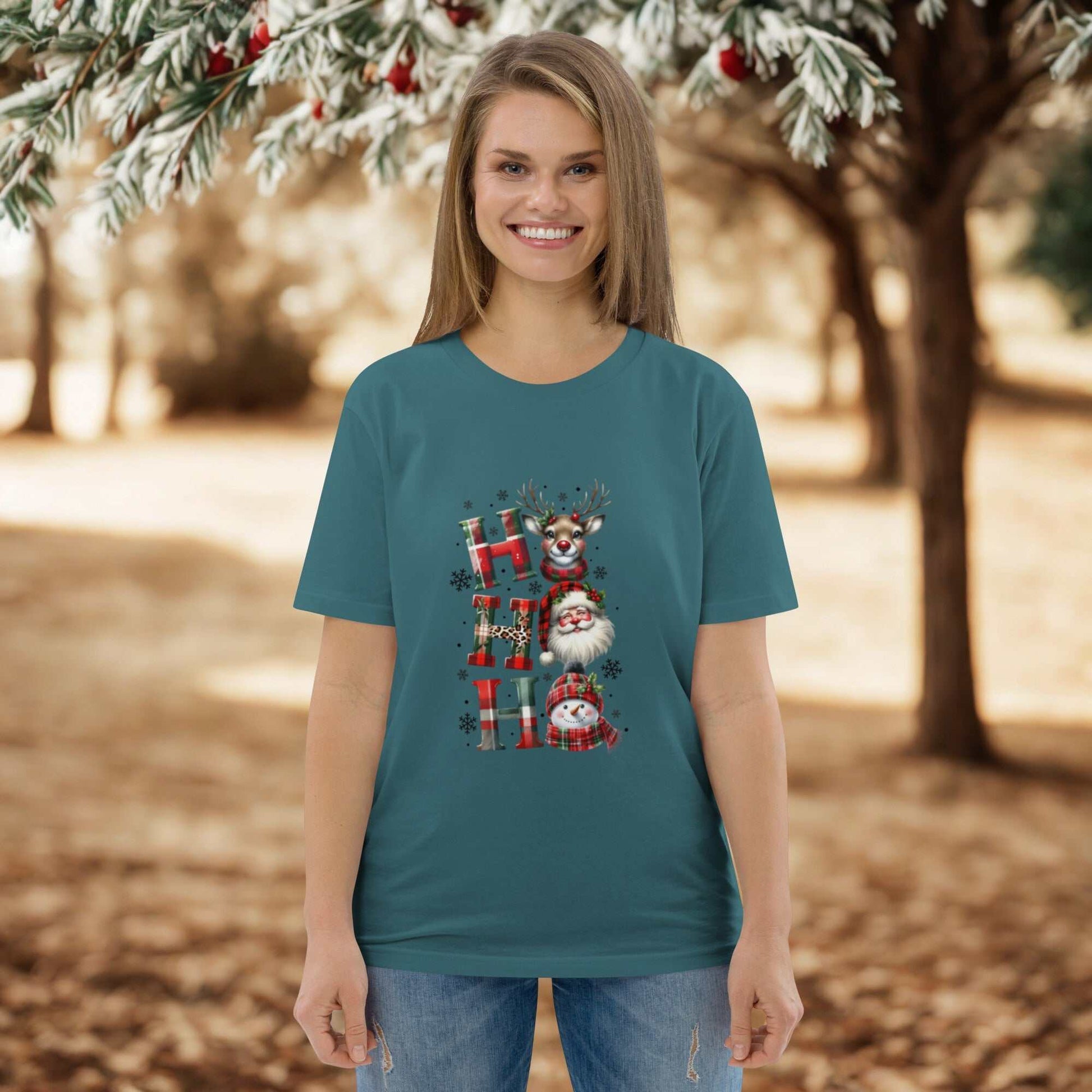 Unisex organic cotton Christmas T-shirt with festive Ho Ho Ho design modeled outdoors
