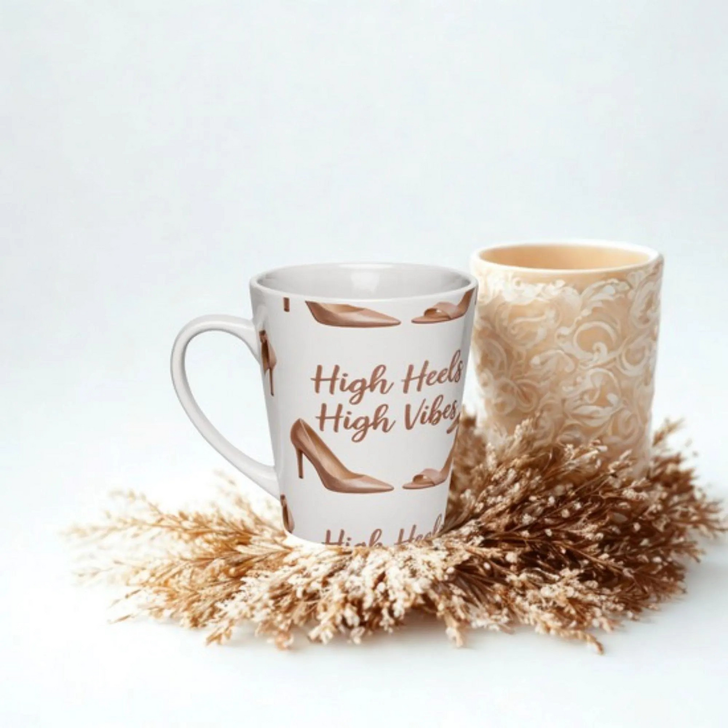 High Heels and High Vibes Latte Mug white ceramic with high heel design and motivational text surrounded by decorative dried flowers