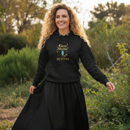 Woman wearing black Glow Mystic in Style Hoodie with gold and blue graphic design outdoors