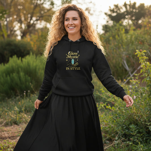 Woman wearing black Glow Mystic in Style Hoodie with gold and blue graphic design outdoors