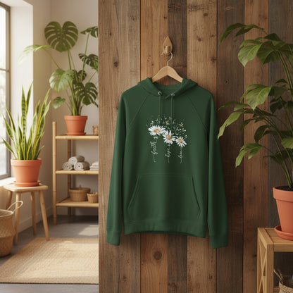 Green unisex eco raglan hoodie with white floral print and inspirational text laid on white flowers background