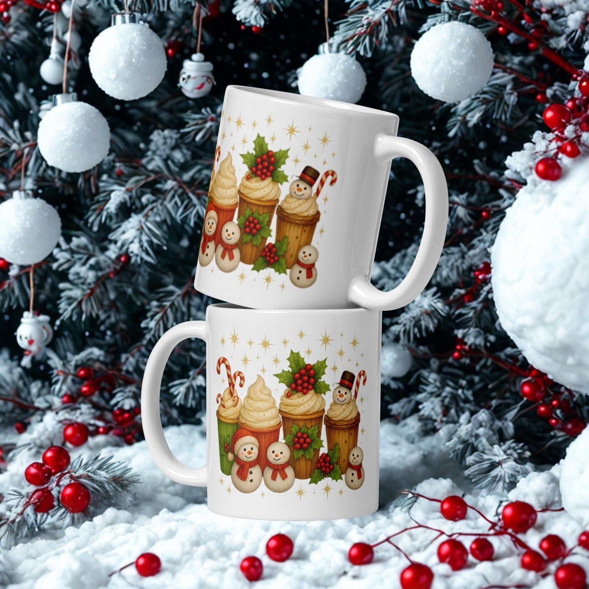 White glossy Christmas mug with festive holiday cupcake and snowman design in winter setting