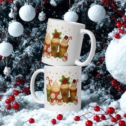 White glossy Christmas mug with festive holiday cupcake and snowman design in winter setting