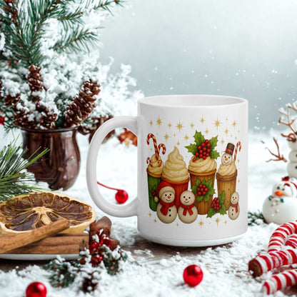 White glossy Christmas mug with festive holiday design featuring snowmen, cupcakes, and candy canes in winter setting