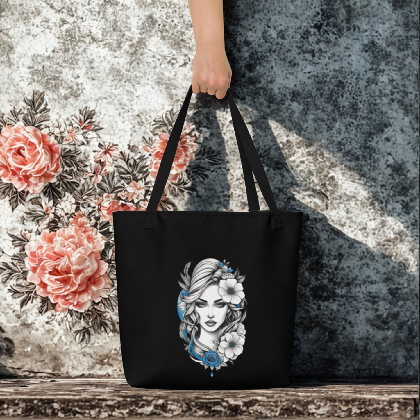 Black tote bag with blue and white floral goddess design, large and durable with comfortable handles