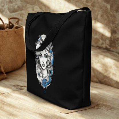 Mystic Blue Floral Goddess large black tote bag with blue and white floral goddess design and comfortable black straps on wooden floor