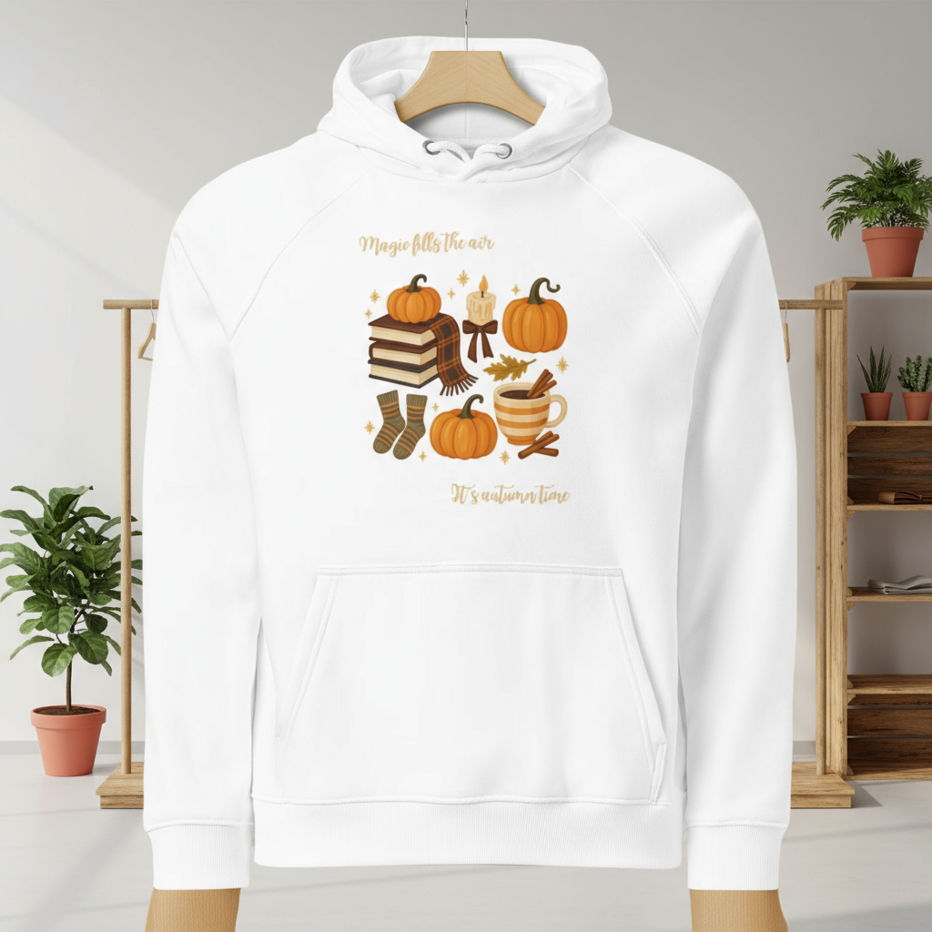 Magic Fills the Air Hoodie white with autumn-themed print including pumpkins, books, candle, socks, mug, and text design