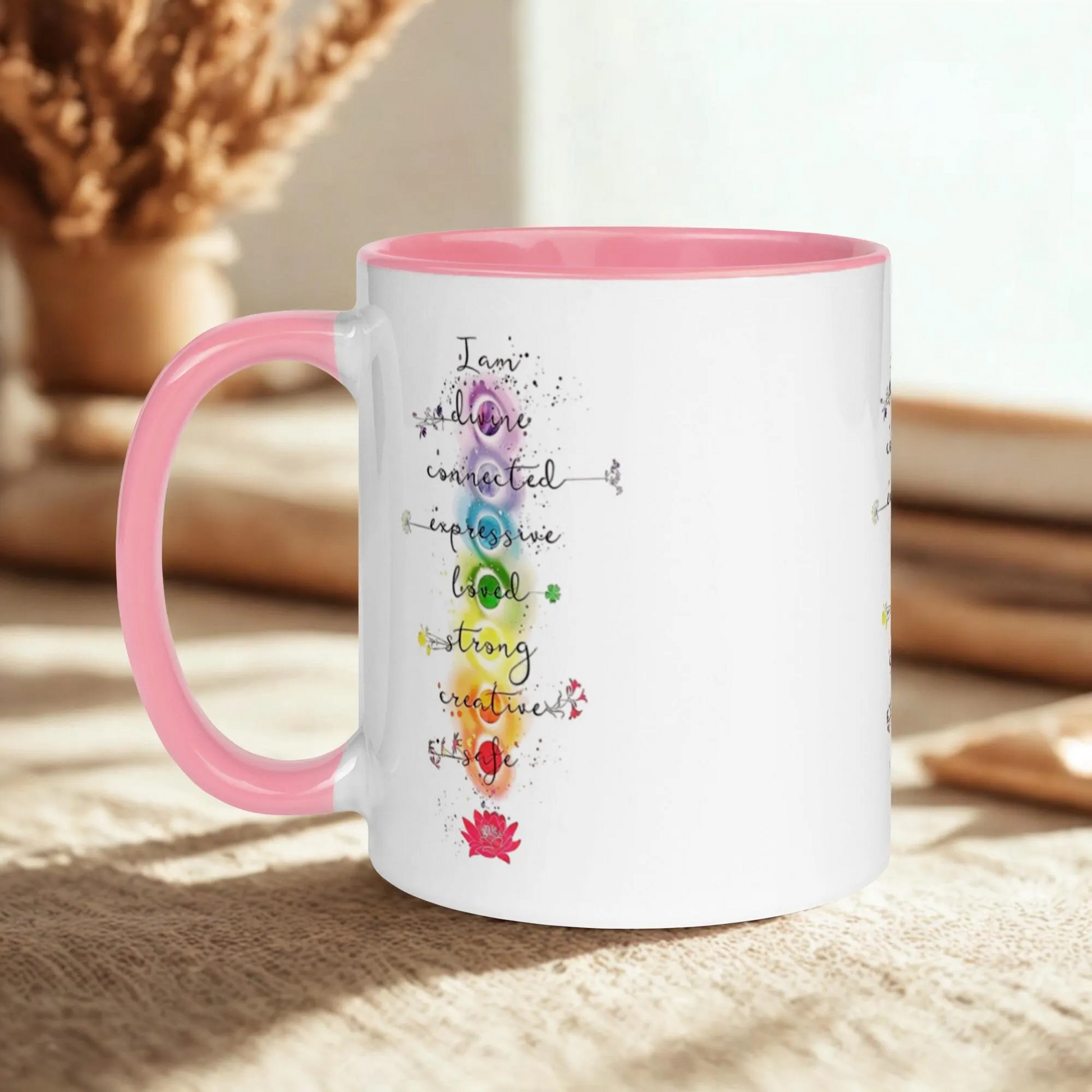 Motivation Chakra Mug with pink handle and interior, chakra-inspired colorful design on white ceramic, microwave and dishwasher safe