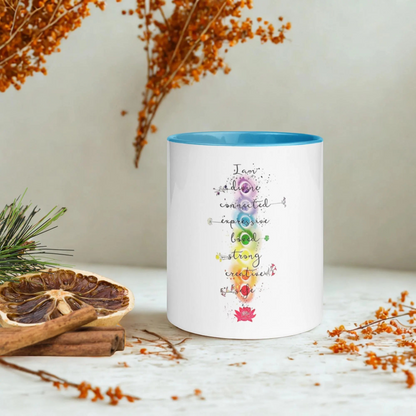 Motivation Chakra Mug with colorful chakra design, ceramic, microwave and dishwasher safe, blue interior and handle.