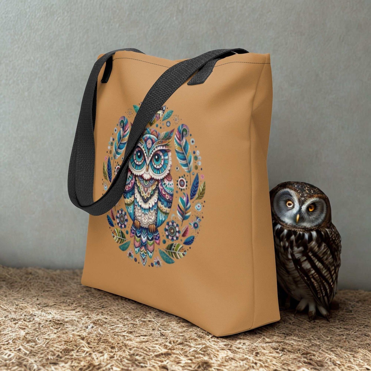 Mystical Owl Tote Bag with vibrant boho owl design and black handles on beige background