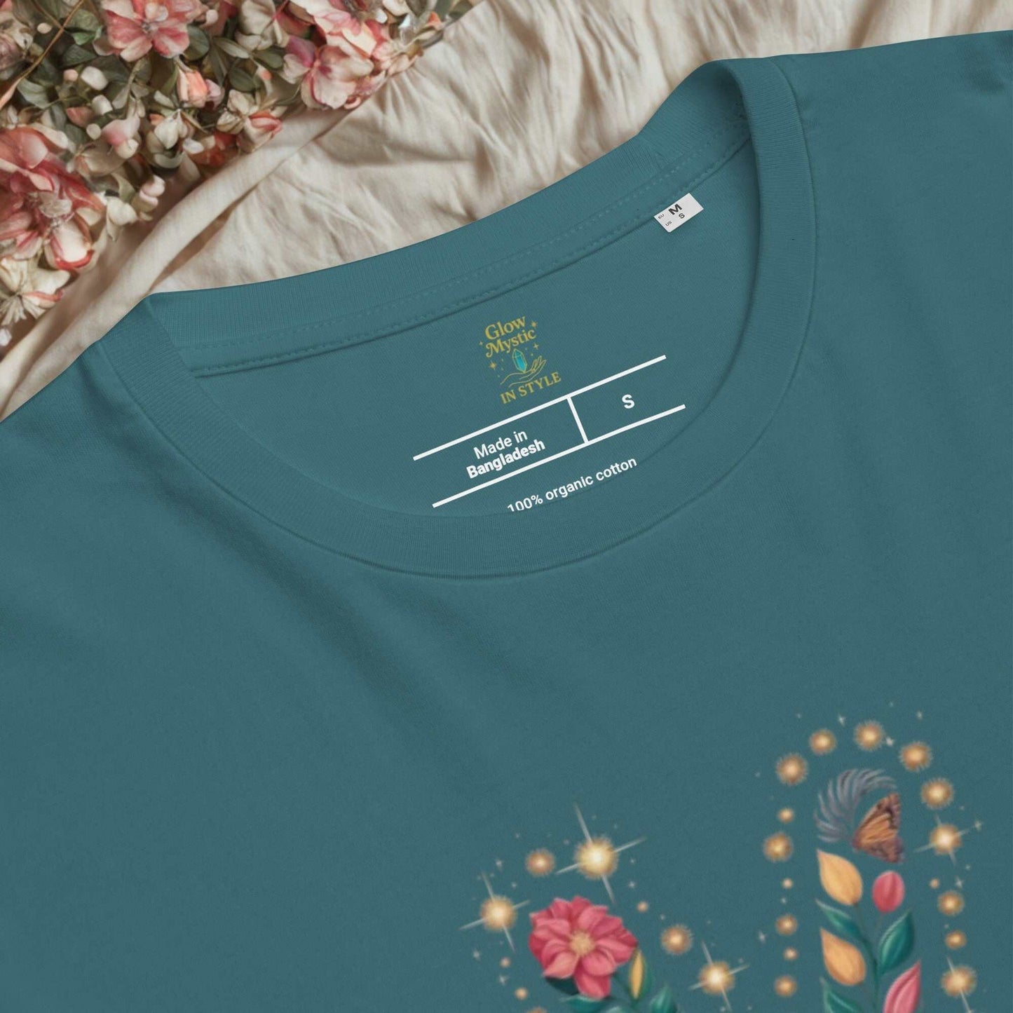 Unisex organic cotton t-shirt in teal with floral graphic print and soft fabric