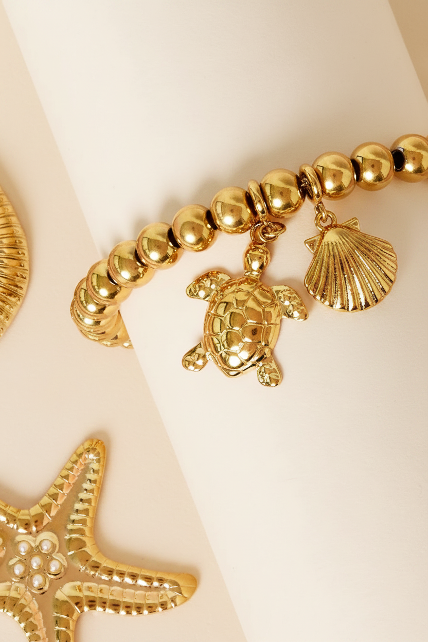 RVS schildpad bedel gecombineerd aan een goudkleurige armband van Glow Mystic in Style