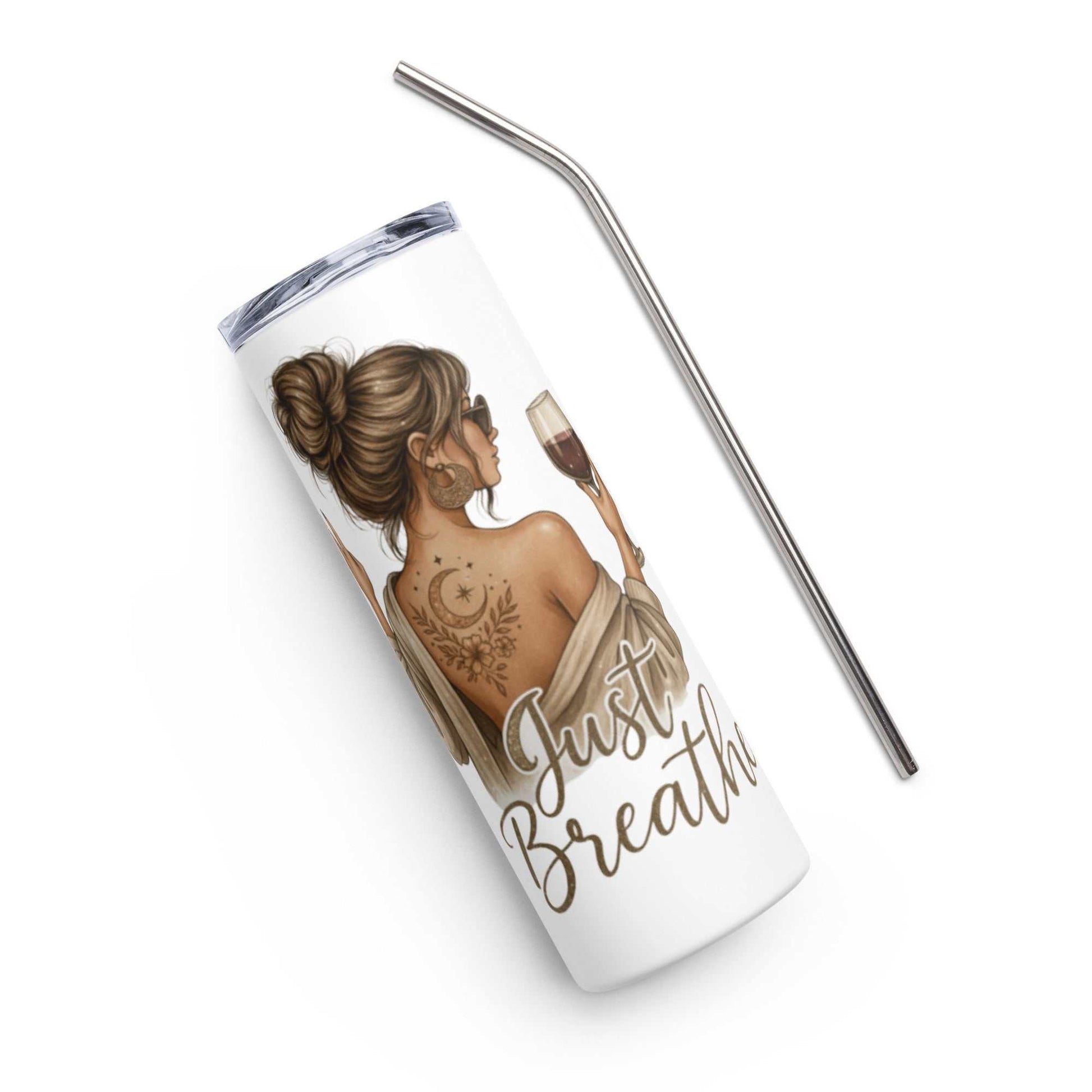 White stainless steel tumbler with "Just Breathe" gold script and illustration of woman with tattoo, accompanied by a metal straw