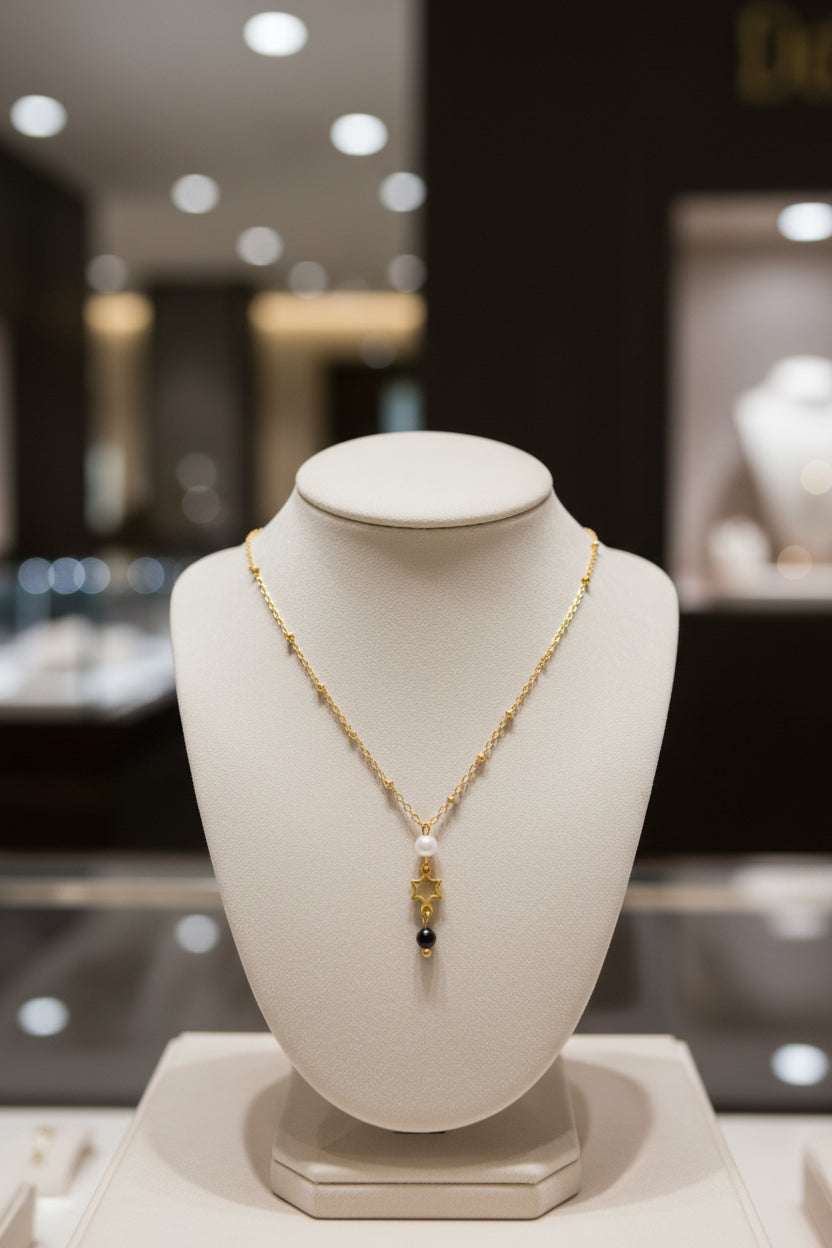 Gouden Ster Hanger Ketting van stainless steel met maansteen en zwarte toermalijn, elegant en spiritueel