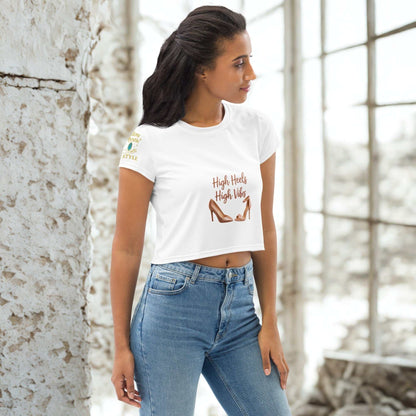 woman wearing white High Heels High Vibes Crop Top with high heel graphic and blue jeans in bright room