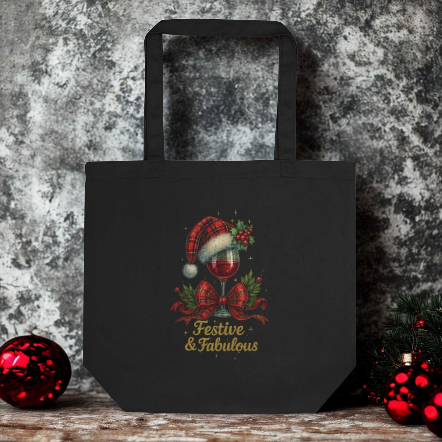 Black eco tote bag with festive holiday wine glass design and "Festive & Fabulous" text