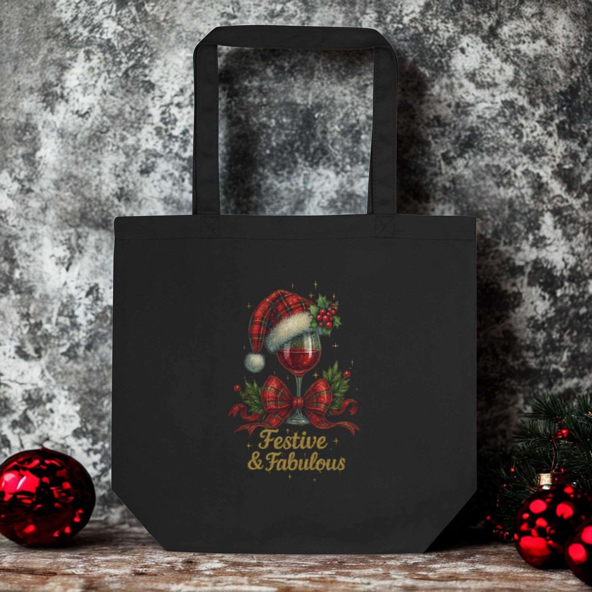 Black eco tote bag with festive holiday wine glass design and "Festive & Fabulous" text