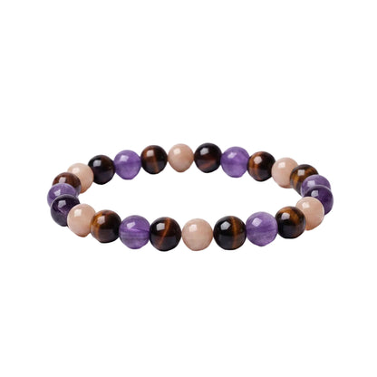 Glow Mystic in Style luxe edelsteen armband met afwisselende kralen van Amethist, Tijgeroog en Zonnesteen, zijaanzicht op witte achtergrond.