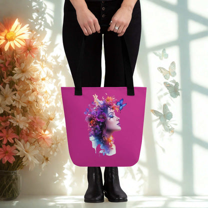 Mystic Butterfly Tote Bag with vibrant butterfly and floral design on pink background, carried by person in black outfit