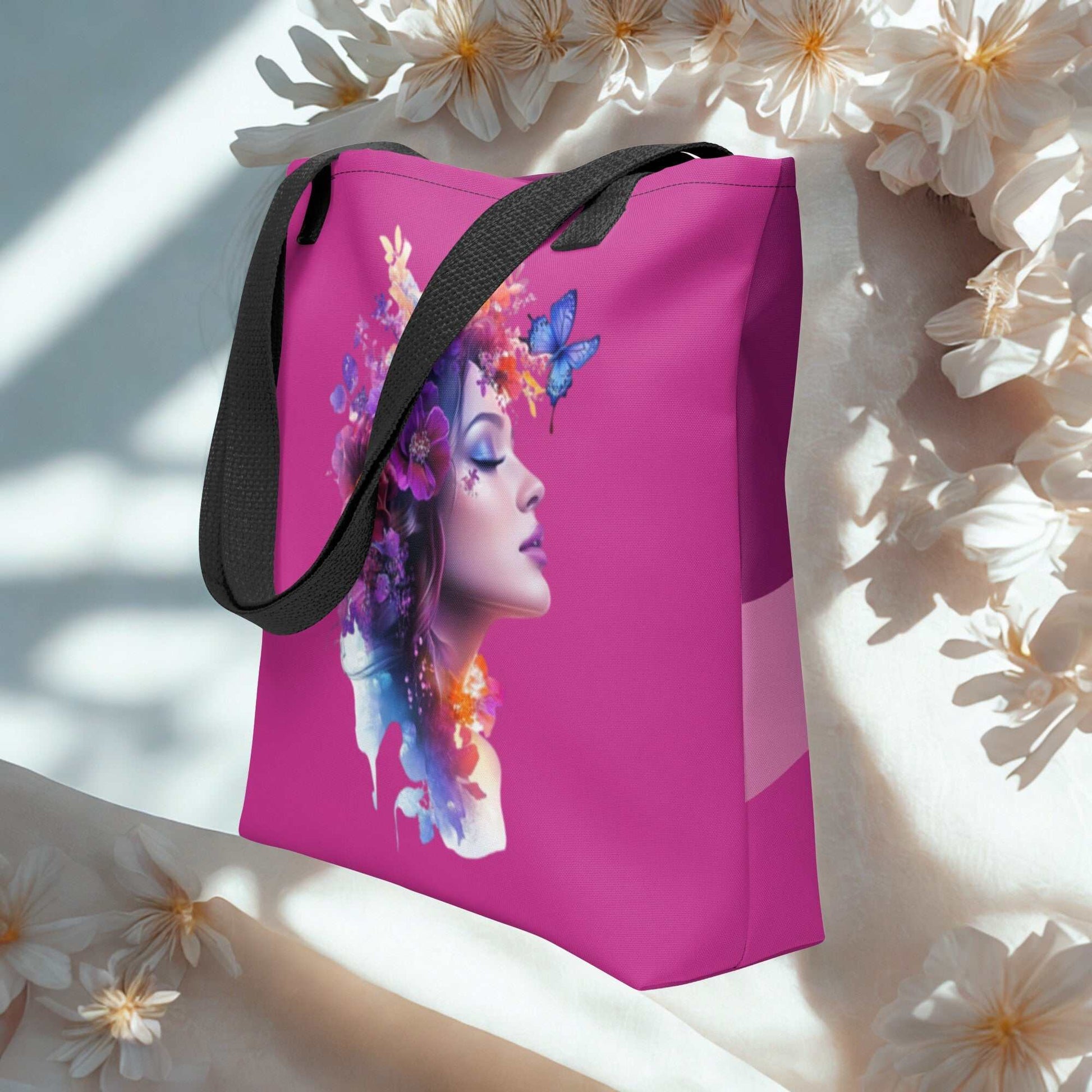 Mystic Butterfly Tote Bag with colorful butterfly and floral woman design on pink background, black handles, eco-friendly reusable fabric.