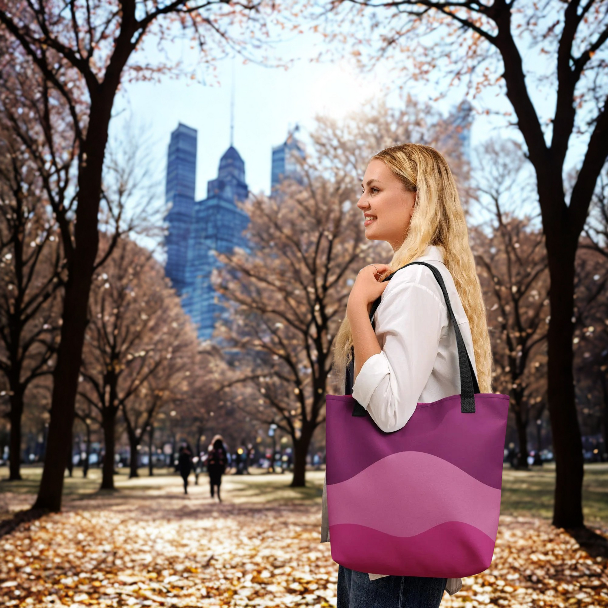 Woman carrying a purple Mystic Butterfly Tote Bag with black handles in autumn park setting