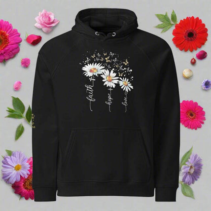 unisex eco raglan hoodie with floral print featuring daisies and inspirational words faith hope love on black sustainable streetwear design