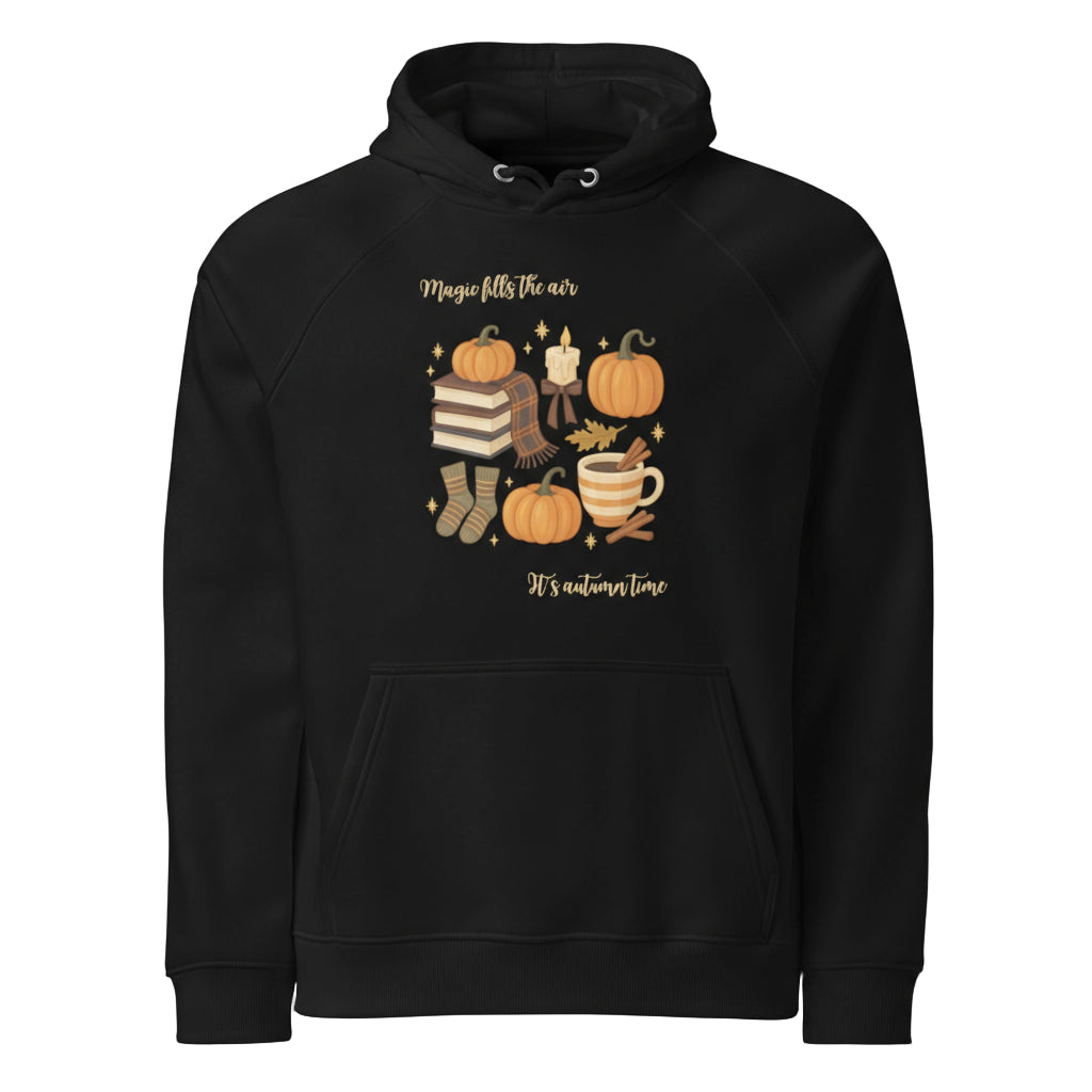 Black Magic Fills the Air Hoodie with autumn-themed design of pumpkins, books, socks, and warm drink